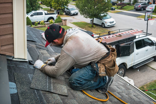Professional Roof Replacement technician working in Wenham, MA